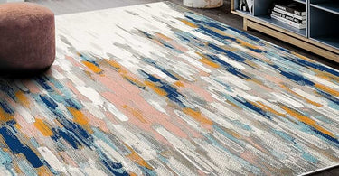 Modern living room featuring 8x10 abstract rug in vibrant colors and minimal furniture layout