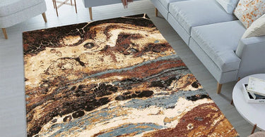 Living room with a modern abstract area rug featuring vibrant colors and bold patterns under a contemporary sofa set