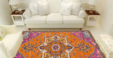 8x10 living room rug styled under a sectional sofa, anchoring the space with color, comfort, and modern design