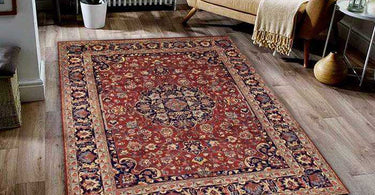Vintage Persian rug with traditional patterns and rich colors displayed in a classic living room with antique furniture