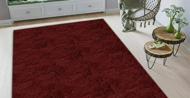 Shag area rug in a kids’ room setting with oval design, plush texture, and colorful furniture around it