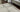 Antique vintage Persian rug on hardwood floor, styled in a classic U.S. home with “Flat 70% Off” sale tag overlay