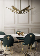 Modern dining room with an 8x10 area rug under a rectangular table and six chairs.