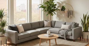 Stylish living room featuring an 8x10 rug under a sofa and coffee table, illustrating 2025 rug size, style, and smart buying tips.