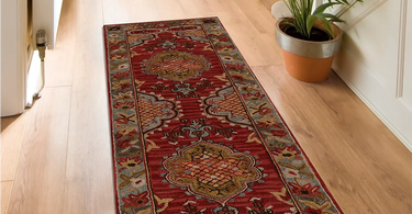 Oval area rug in a hallway with natural lighting and neutral decor