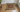2x3 rust and ivory traditional rug inside a front door with a tape measure along its 36-inch side