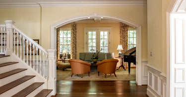 Traditional Persian area rug with intricate red and gold design in elegant living room