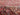 Red area rug 8'5" X 12 - styled in a bedroom