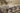 Black area rug 6'6" X 9 - styled in a bedroom