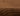 Brown Wool area rug 6' X 9' - styled in a bedroom
