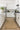 Beige Contemporary area rug 10' X 14' - styled in a living room