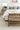 Ivory Wool area rug 6'3" X 9 - styled in a living room