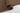Brown Polyester area rug 10' X 14' - styled in a dining room