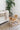 Beige area rug 8' X 10' - styled in a living room