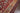 Red area rug 9'6" X 13 - overhead flat lay view