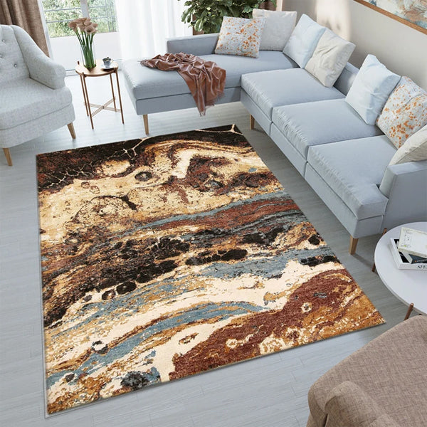 Living room with a modern abstract area rug featuring vibrant colors and bold patterns under a contemporary sofa set