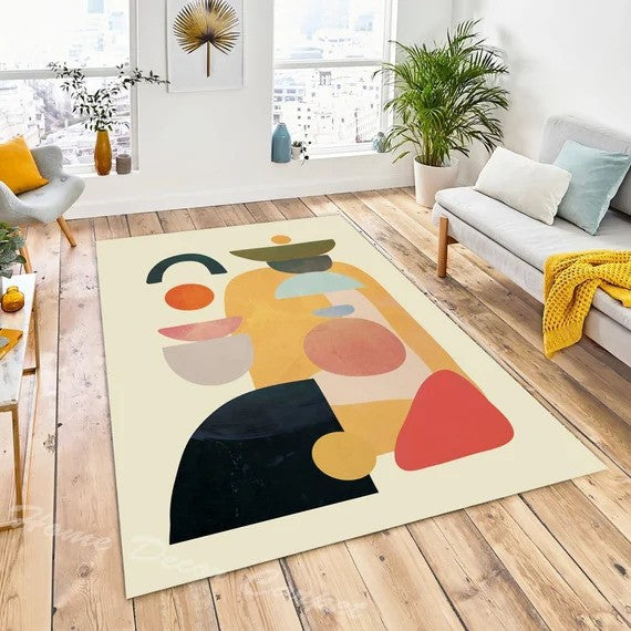 Abstract area rug in a modern living room with neutral furniture and artistic decor.