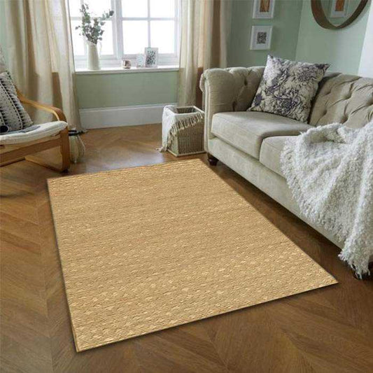 Natural jute rug in a 9x12 size placed in a cozy living room with wooden flooring and neutral-toned furniture