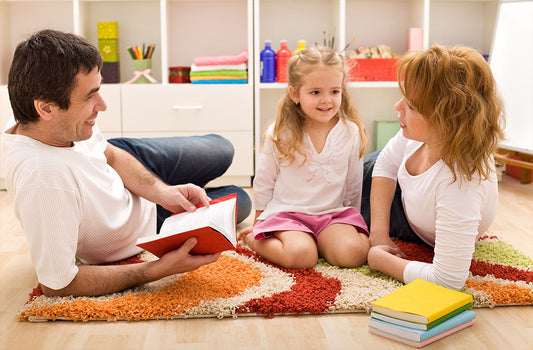 Colorful 8x10 and round washable kids rugs displayed in a bright playroom with soft toys, storage bins, and cozy seating