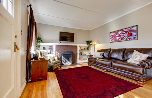 Modern living room with a large 8x10 area rug under the seating arrangement, adding warmth and structure to the space