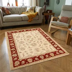 Spacious living room with a large 9x12 area rug anchoring a sofa set, adding warmth and elegance to the space
