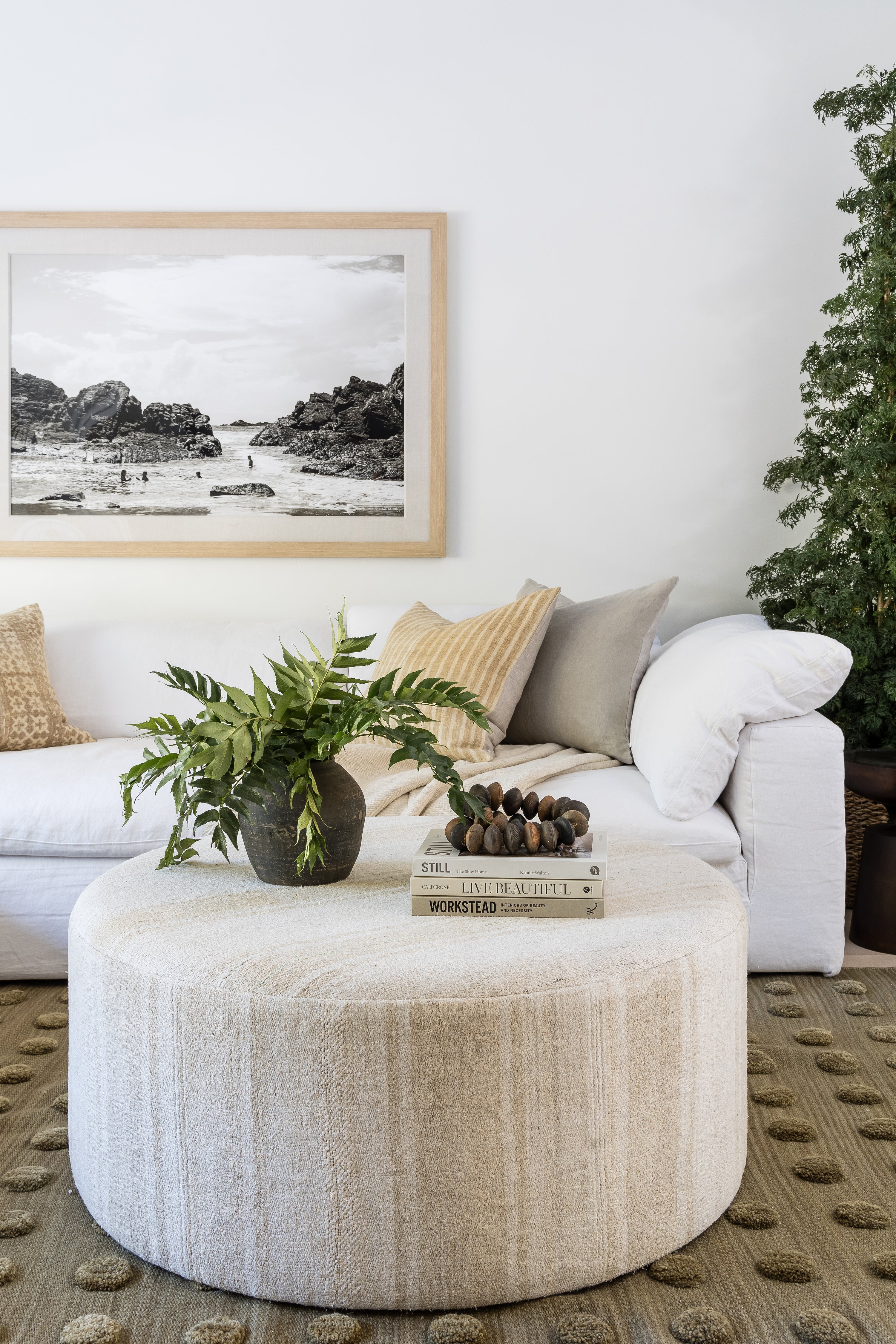 A luxurious wool rug enhancing a cozy, modern living room with timeless texture and natural warmth.