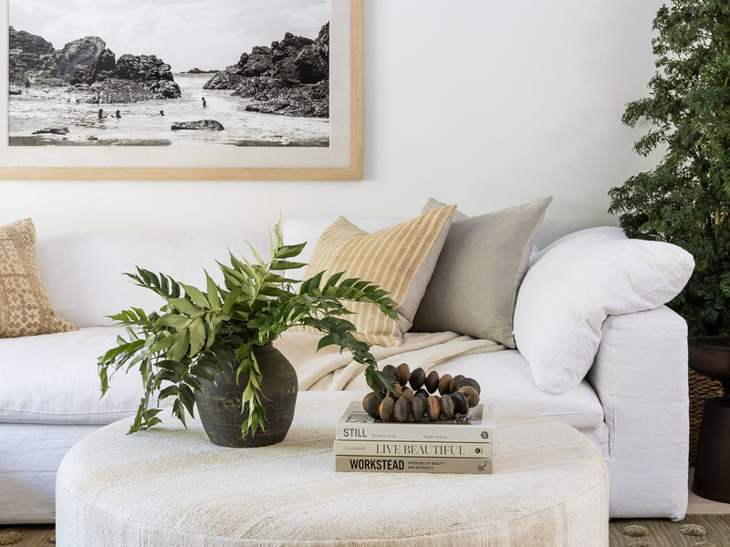 A luxurious wool rug enhancing a cozy, modern living room with timeless texture and natural warmth.