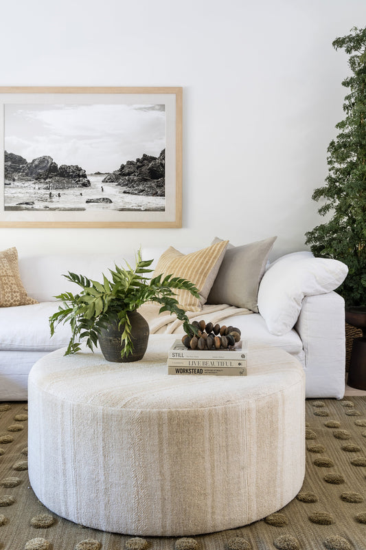 A luxurious wool rug enhancing a cozy, modern living room with timeless texture and natural warmth.