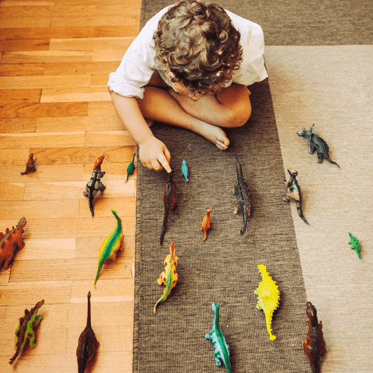 Colorful kids rectangular rug in a playful bedroom setup with toys, bookshelf, and cozy decor
