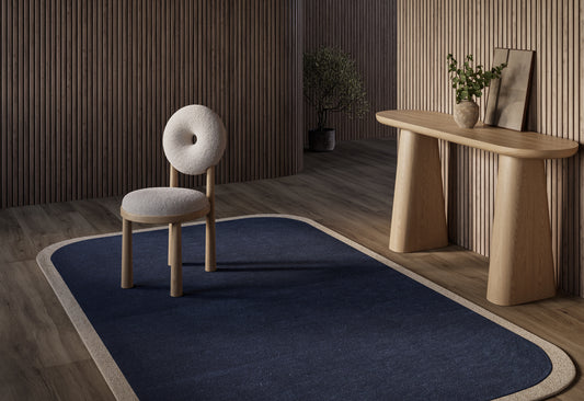 A cozy living room featuring a wool rug, showcasing its versatility and year-round comfort.