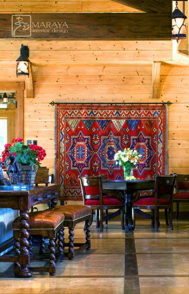 Farmhouse-style living room featuring a large 9x12 neutral rug under a wooden coffee table and linen sofa in a cozy, rustic setting