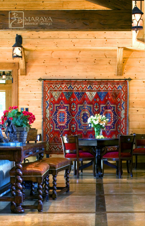 Farmhouse-style living room featuring a large 9x12 neutral rug under a wooden coffee table and linen sofa in a cozy, rustic setting