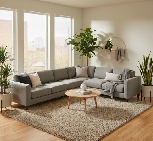 Stylish living room featuring an 8x10 rug under a sofa and coffee table, illustrating 2025 rug size, style, and smart buying tips.