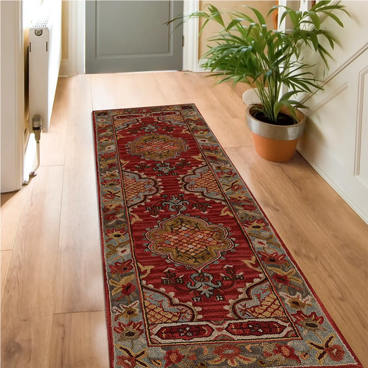 Oval area rug in a hallway with natural lighting and neutral decor