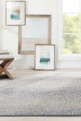 Woodland WOD-1 antelope blue wool rug styled in elegant living room