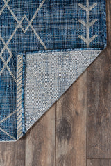 Villa Monaco VI-08 rug styled with wicker chairs and outdoor plants