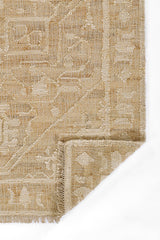 Durable handmade rug crafted from ivory jute and wool fibers.