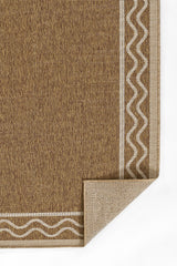 Durable natural handwoven-look rug placed under patio dining set