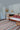 Multi Wool area rug 9' X 12' - styled in a bedroom