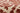 Red area rug 5'3" X 7 - styled in a bedroom