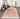 Red Polyester area rug 2' X 3' - styled in a dining room