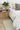 Ivory Wool area rug 6'3" X 9 - styled in a bedroom