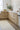 Ivory Wool area rug 6'3" X 9 - styled in a dining room