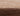 Brown Abstract area rug 2' X 3' - styled in a bedroom