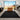 Black Polyester area rug 5' X 8' - styled in a dining room