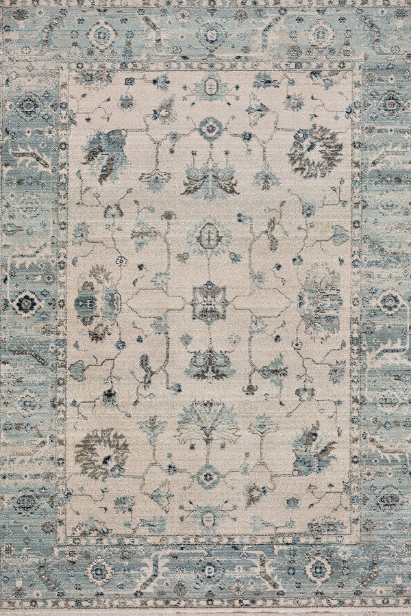Landis-Ushak Ivory Blue Area Rug