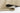 Beige Contemporary area rug 5' X 8' - styled in a living room