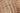 Tan Polypropylene area rug 3'3" X 5 - styled in a dining room