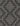 Black Polypropylene area rug 3'3" X 5 - styled in a dining room