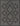 Black Polypropylene area rug 5'3" X 7 - styled in a living room